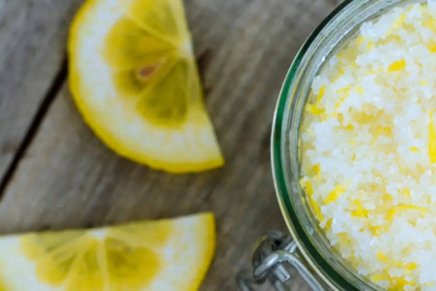 Lemon and salt on a table used to clean stains.