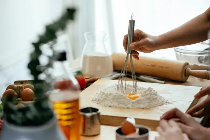 making pasta from scratch to stretch your budget further and create Large Family Dinner Ideas.