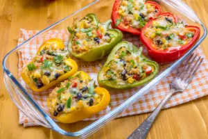 stuffed bell peppers filled with meat and veggies, and topped with cheese. A cheap and delicious large family dinner idea.